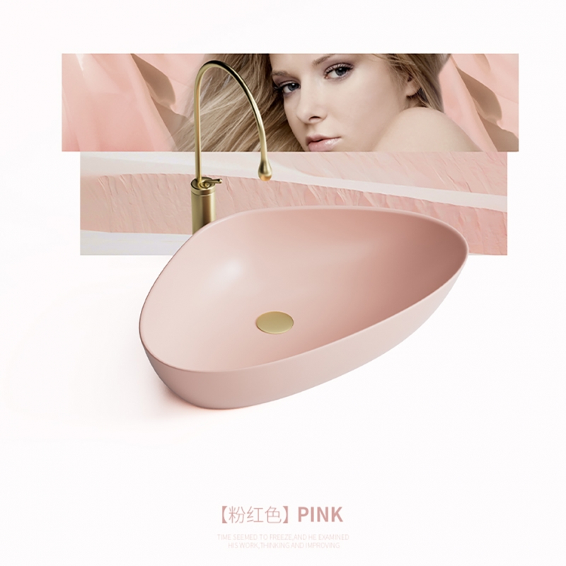 Triangle shape wash basin in matt pink color for project